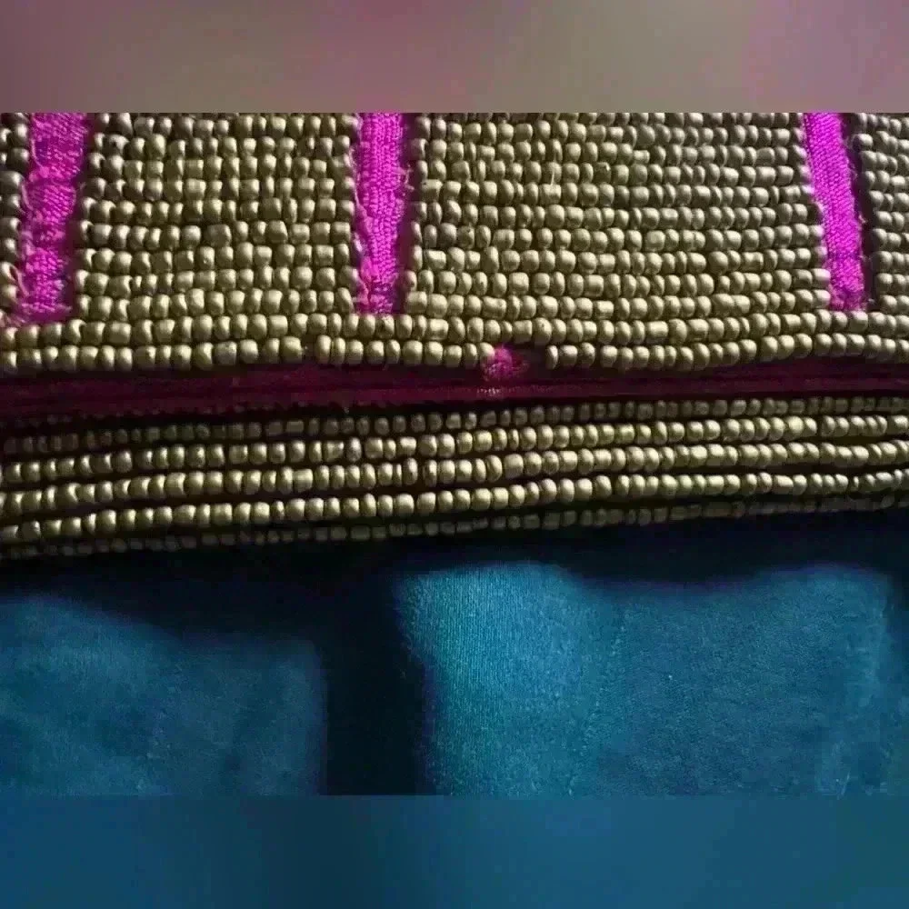 ExpressionsNYC clutch. Pick with gold beads. Good condition pink sink inside